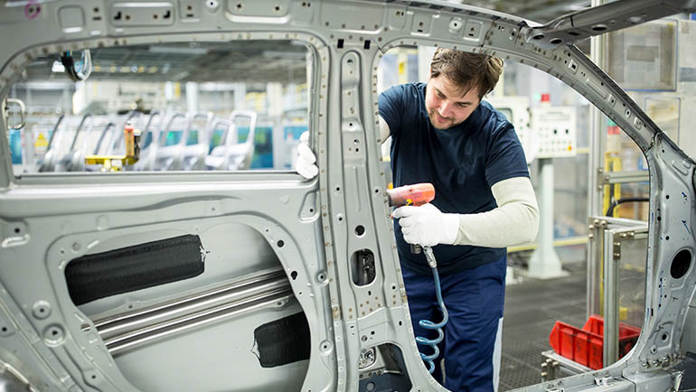 Man working in modern car factory